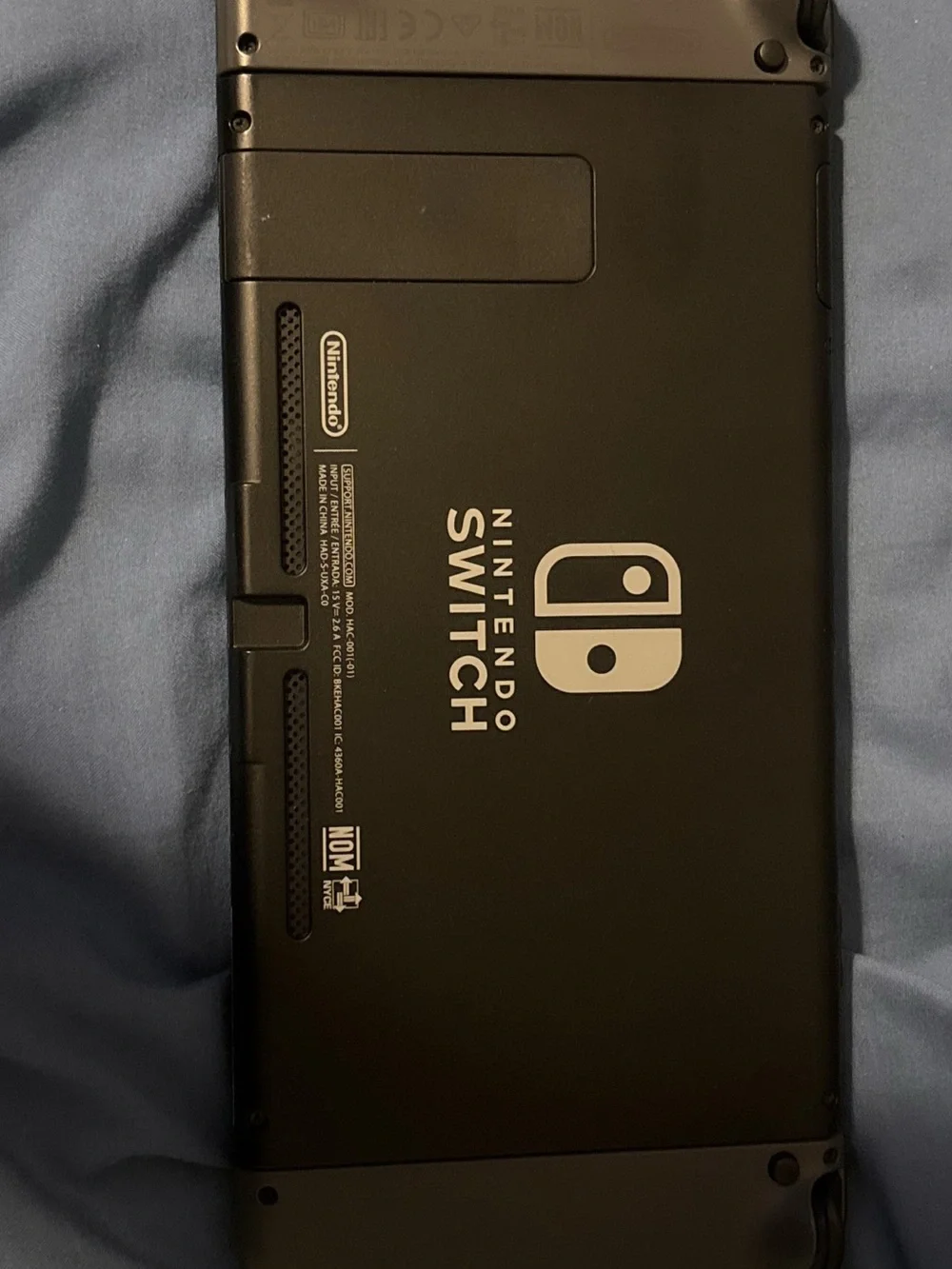Nintendo Switch Console with Dark Gray Joy‑Con and Black Dock